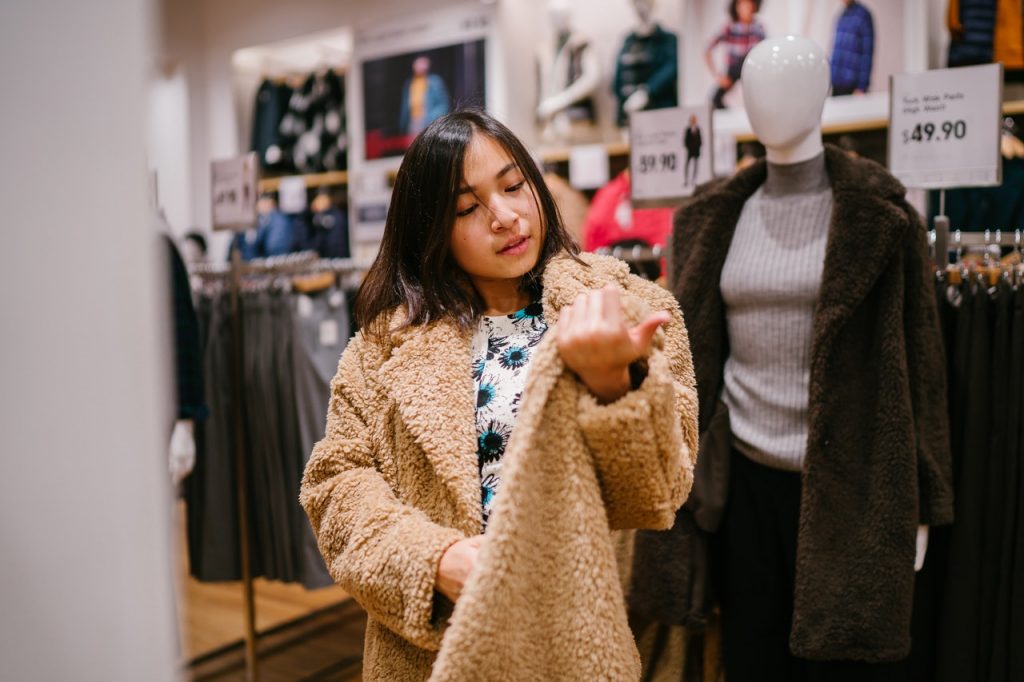 A girl shopping for winter outfits